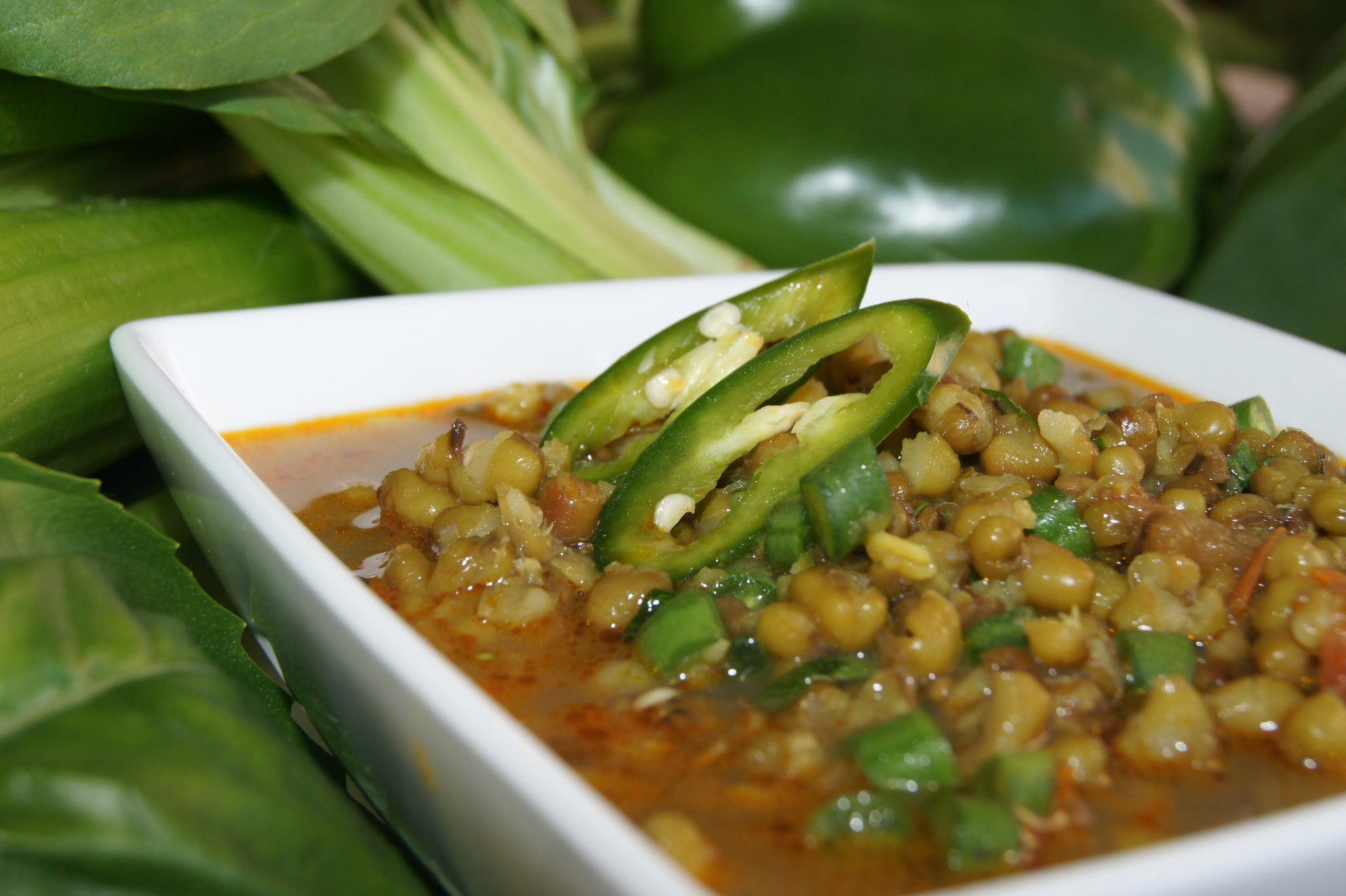 our green moong dhal is perfect on its own or as a base for your creation. cooked with los of green veggies and topped with delicious fresh jalapeños. yummy dhal or dahl is authentic and wholesome to traditional Ayurveda diets